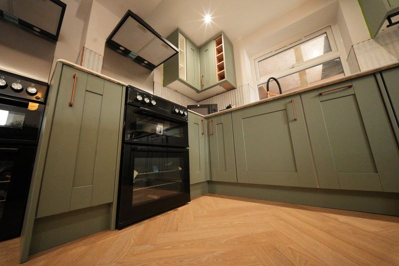 Green kitchen units and ovens