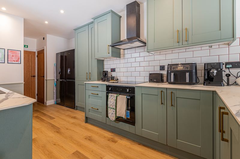 Kitchen with range of appliances